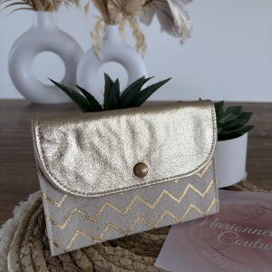 Portefeuille en similicuir et tissu motif géométrique doré